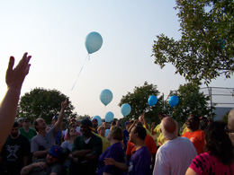 Blue balloons floating to the sky